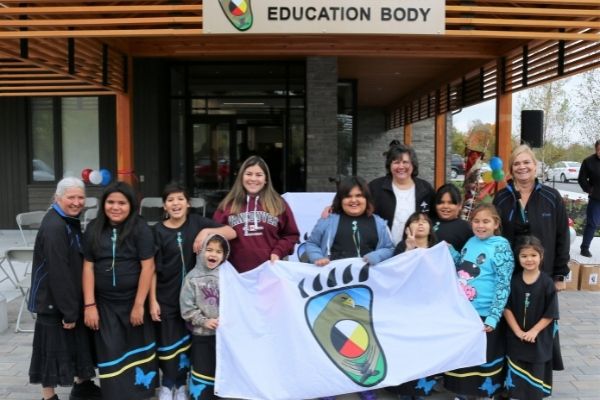 students holding aes flag